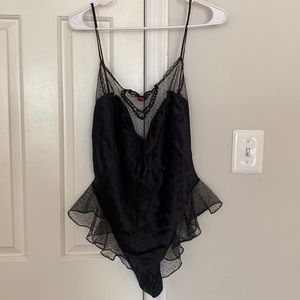 Black lace and silk with a deep V front and a small rose in the center